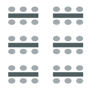 Two columns of tables with three chairs on either side. 