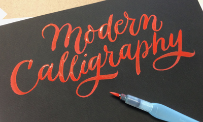 Words "modern calligraphy" written in the art style of modern calligraphy