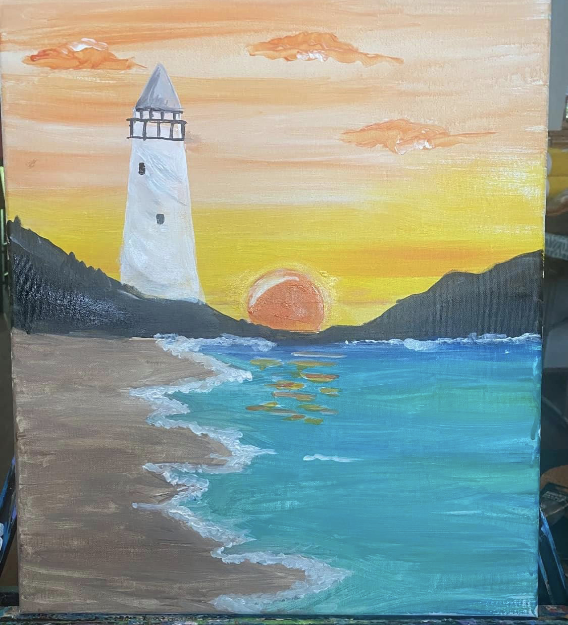Painting of a beach at sunset with a lighthouse in the background.