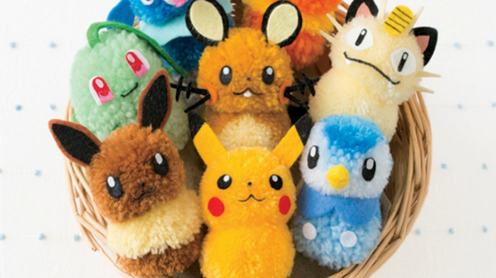 a handful of yarn pompoms turned into pokemon