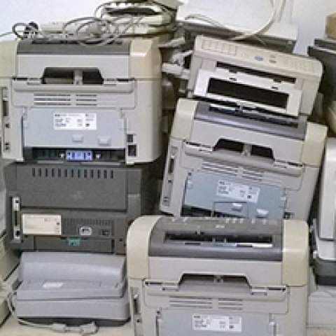A stack of old printers