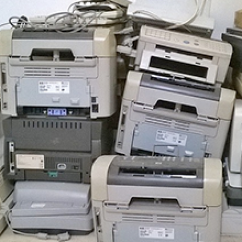 A pile of broken printers