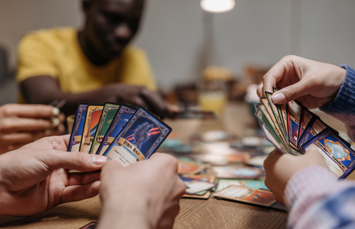 Tweens playing a card game