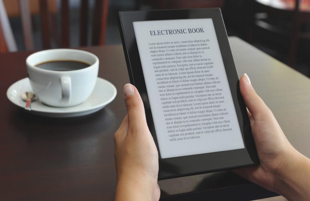 hands holding an e-book reader