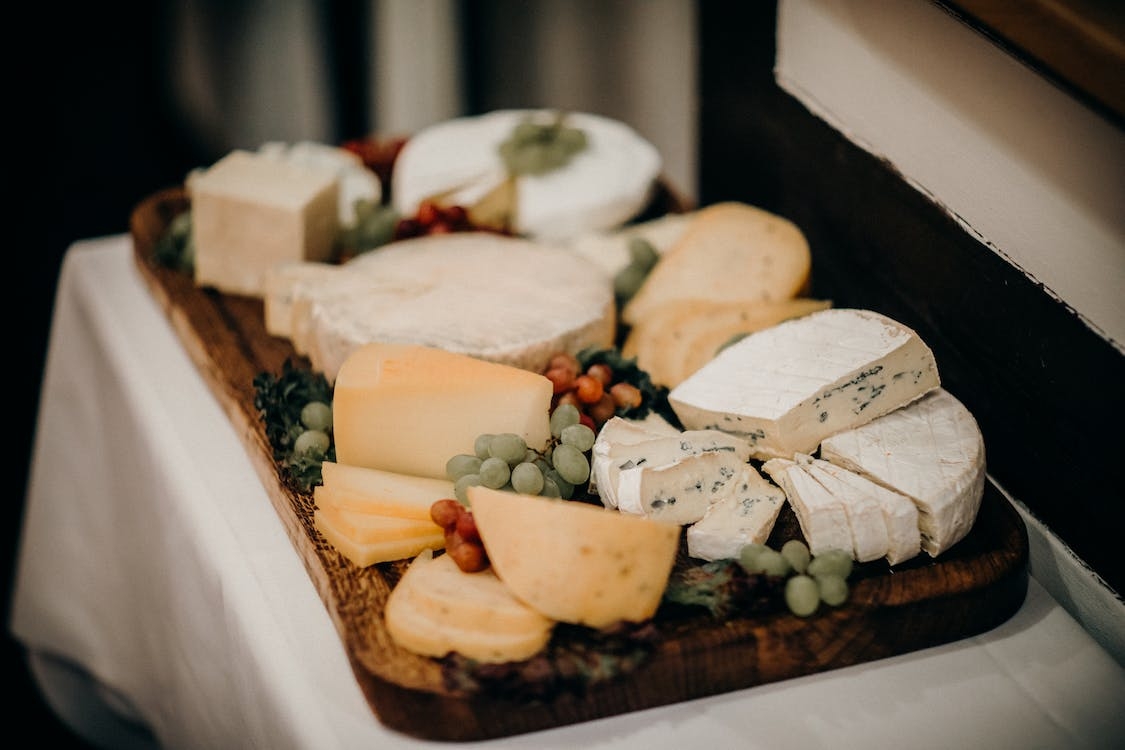 Different types of cheeses on a platter